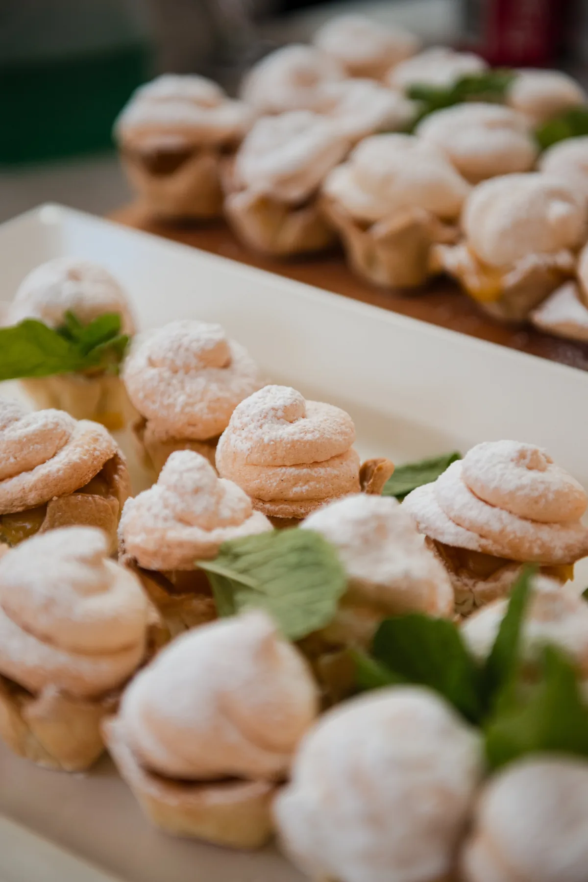 Birthday pastries arranged with mint leaves