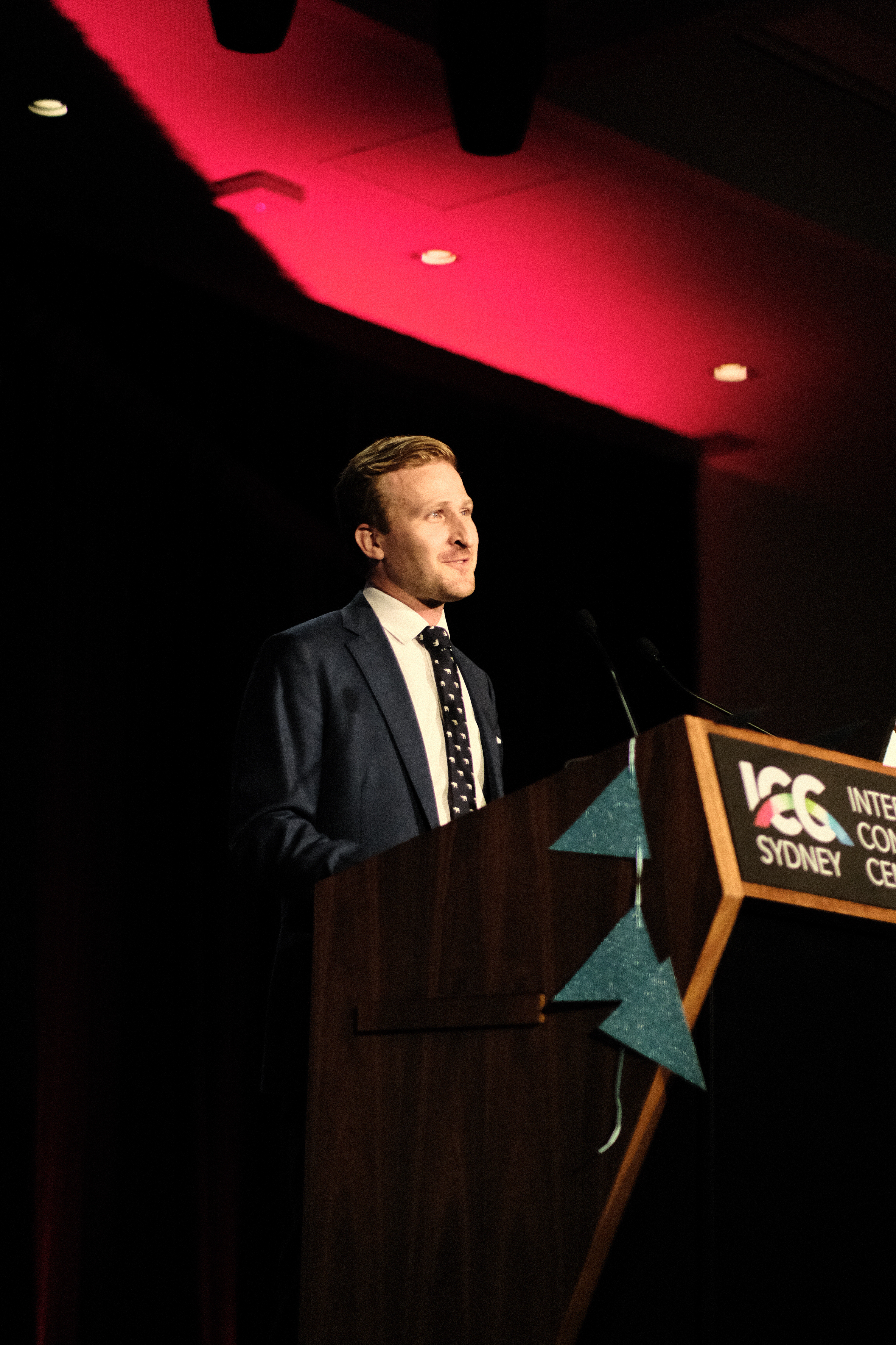 Couple sharing intimate moment under stained glass arch